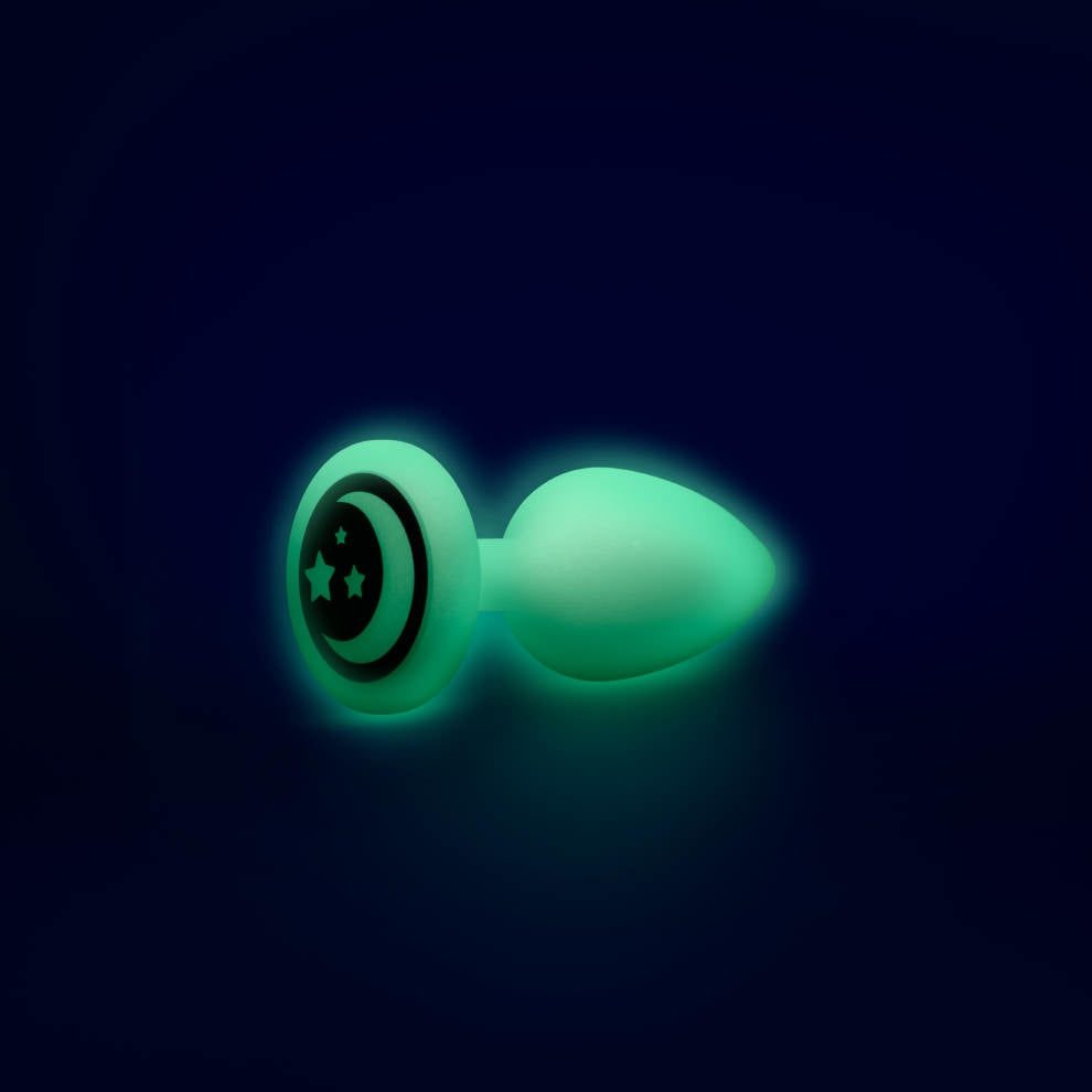 Glow-in-the-dark anal plug with moon and stars design.