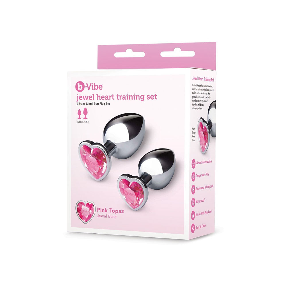 A 2-piece metal butt plug set with pink jewel heart bases.