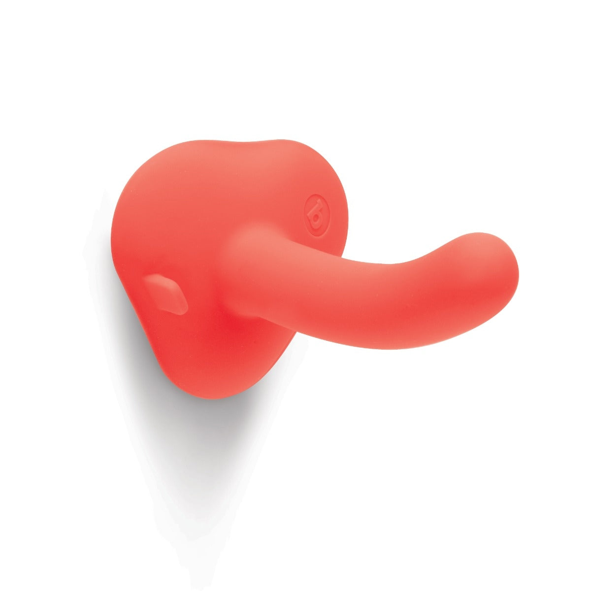 A coral-colored silicone dildo with a curved tip and a heart-shaped base.