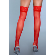 Sheer red lace thigh-high stockings with a back seam and clear heels.