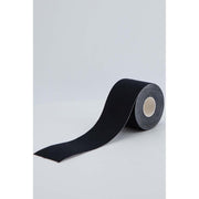 Black adhesive breast lift tape roll made of cotton.
