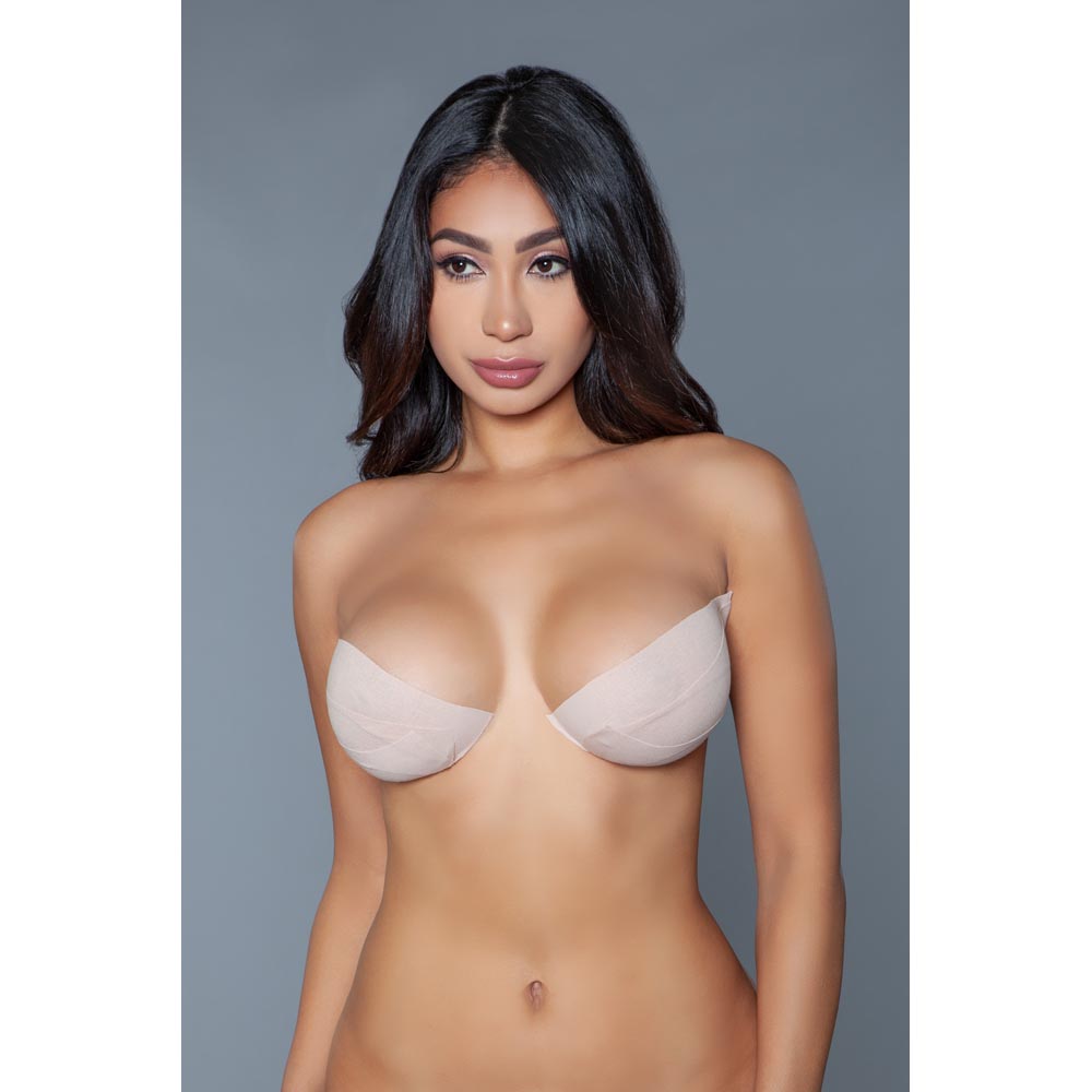 Nude waterproof adhesive breast lift tape roll.