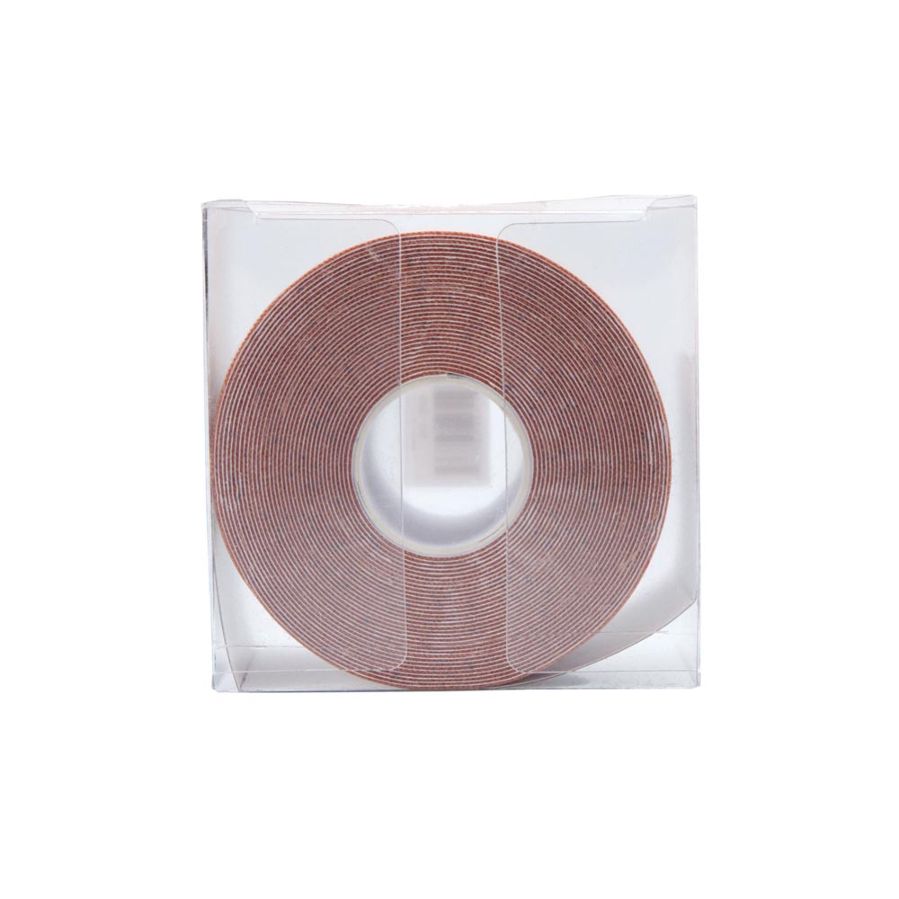 Roll of nude waterproof adhesive breast lift tape in clear packaging.