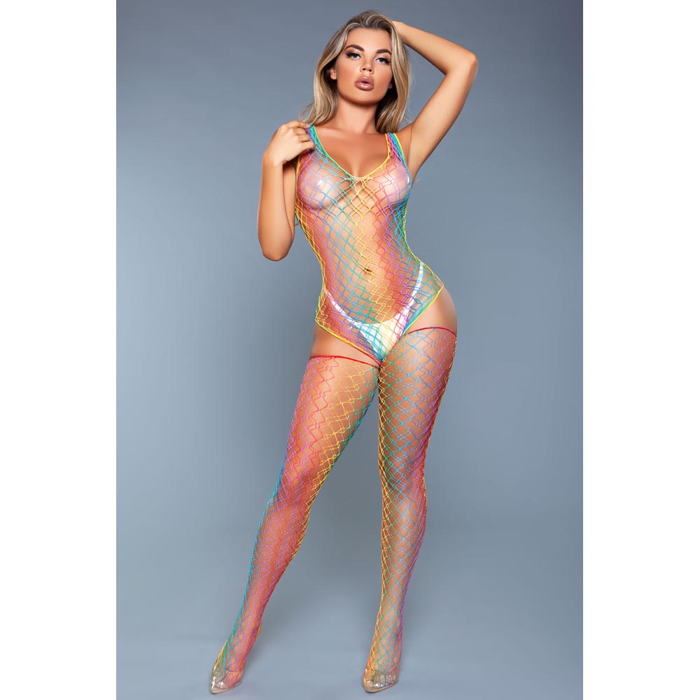 A woman wears a rainbow fishnet bodystocking with matching thigh-highs.
