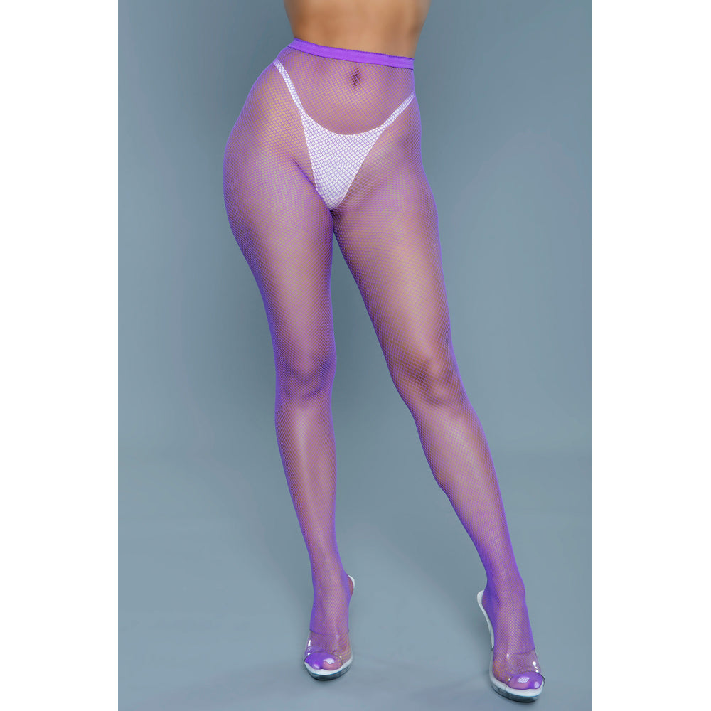 Purple mini fishnet pantyhose with a white thong visible underneath.