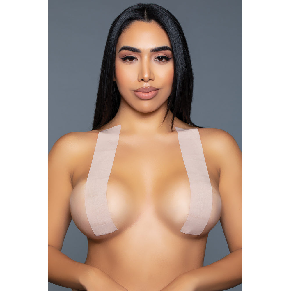 Nude colored double sided breast lift tape roll.