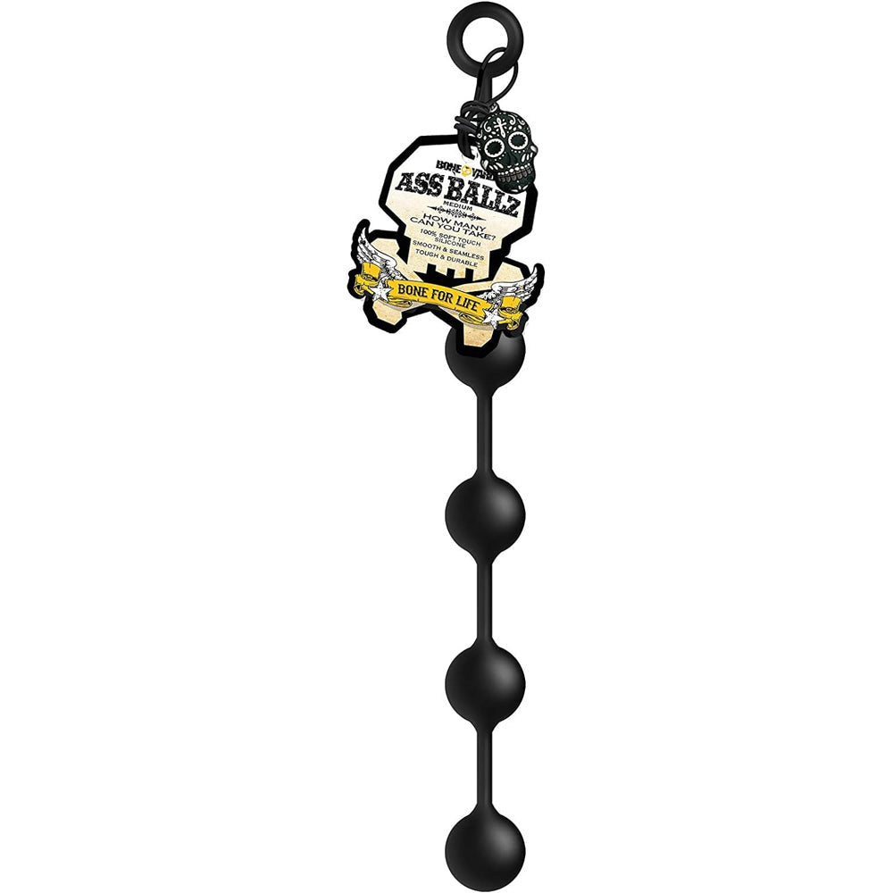 Black silicone anal bead chain with a skull tag.