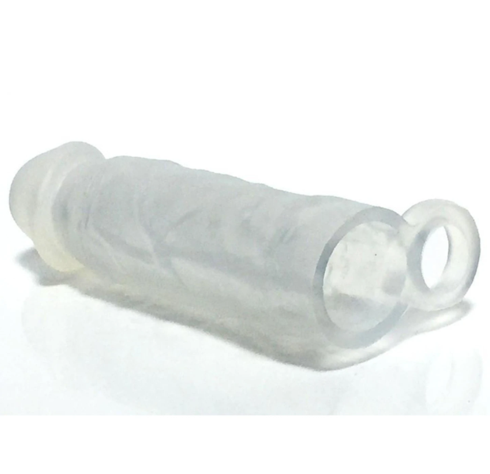 Clear silicone penis extender with textured surface and integrated cock ring.