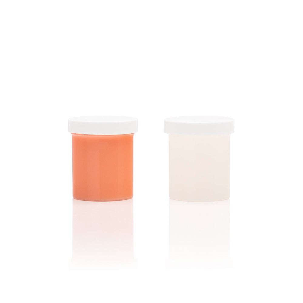 Two plastic containers with white lids, one filled with orange silicone and the other with light-colored silicone.