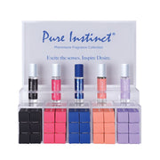 Pure Instinct Pheromone Fragrance Collection display with five rollerball perfumes and boxes.