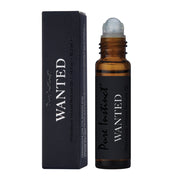 Pure Instinct Wanted Men's Pheromone Infused Perfume Oil roll-on bottle and box.