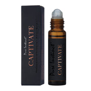 Pure Instinct Captivate pheromone infused perfume oil in a rollerball bottle.
