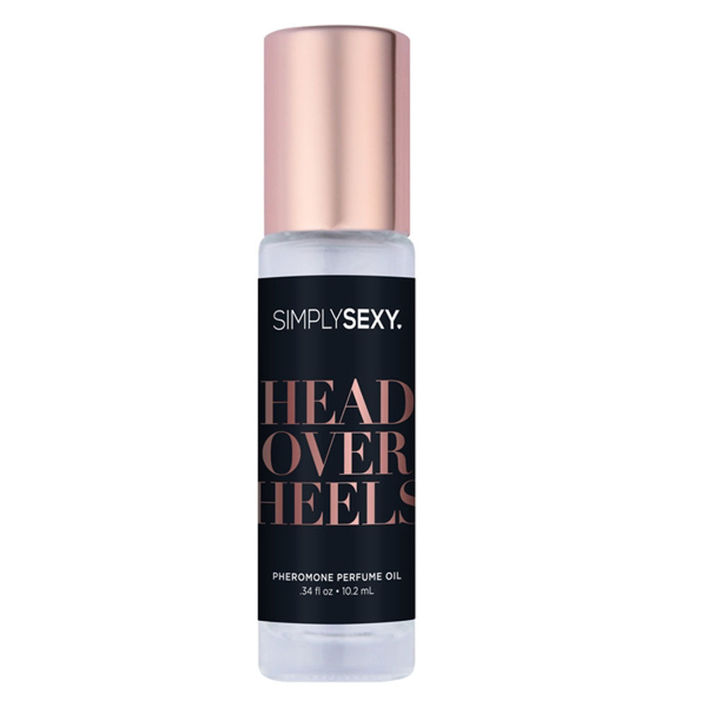 A bottle of SimplySexy Head Over Heels pheromone perfume oil with a rose gold cap.
