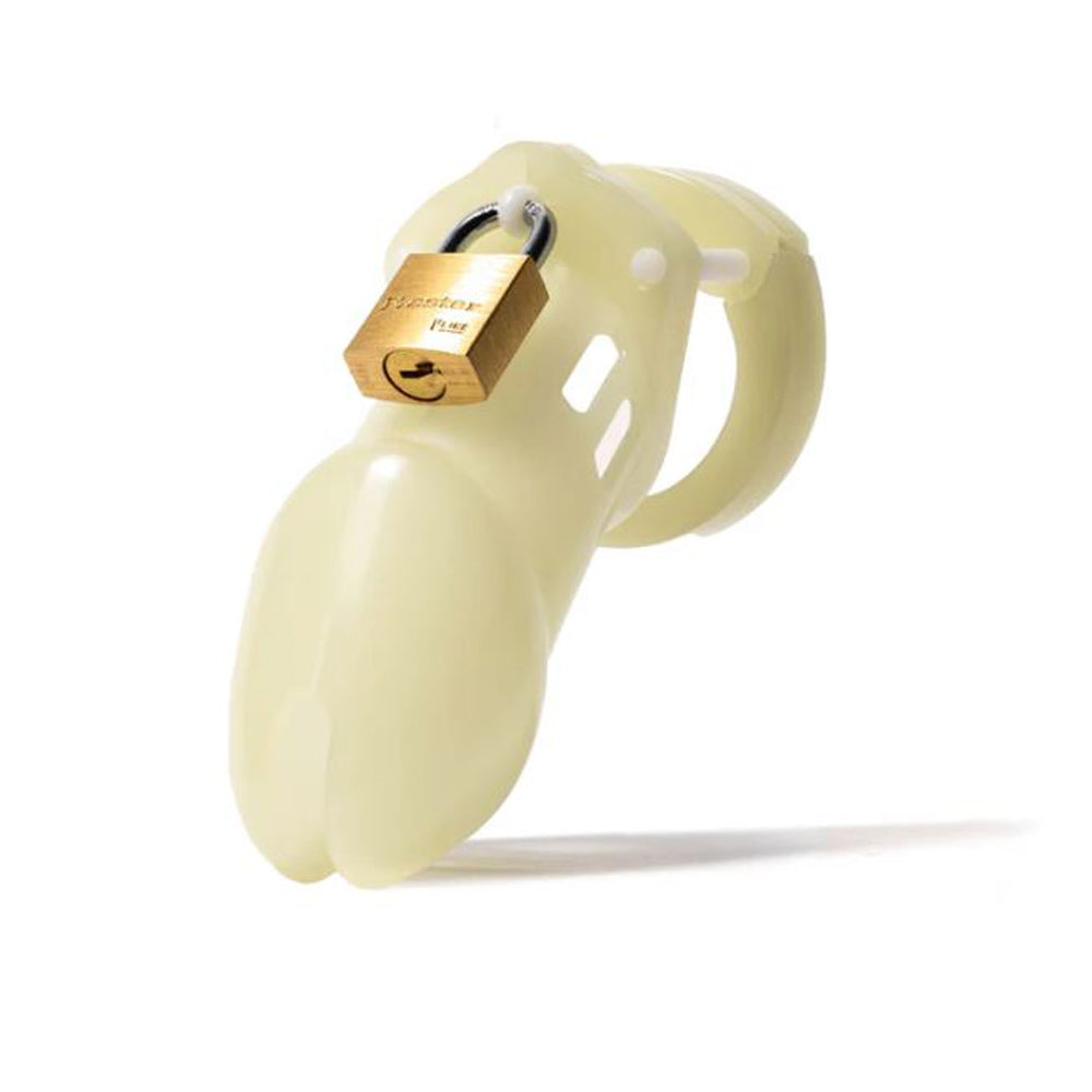 A glow-in-the-dark chastity cage with a brass lock.