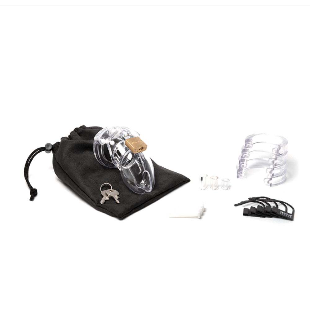 Clear polycarbonate chastity cage kit with lock, keys, and storage bag.