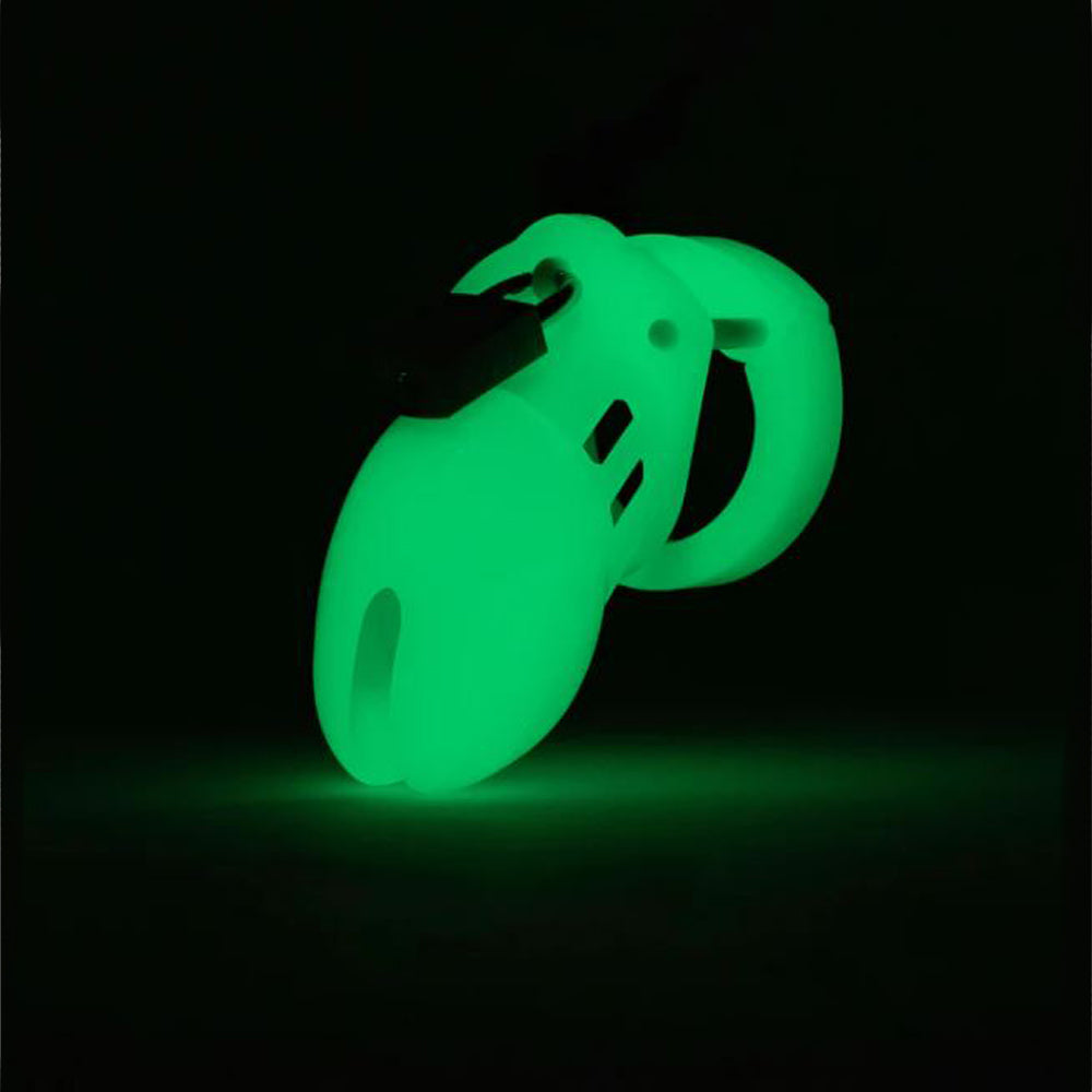 Glow-in-the-dark chastity cage with a curved design.