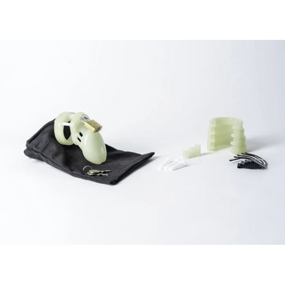 Glow-in-the-dark chastity cage kit with lock and keys.