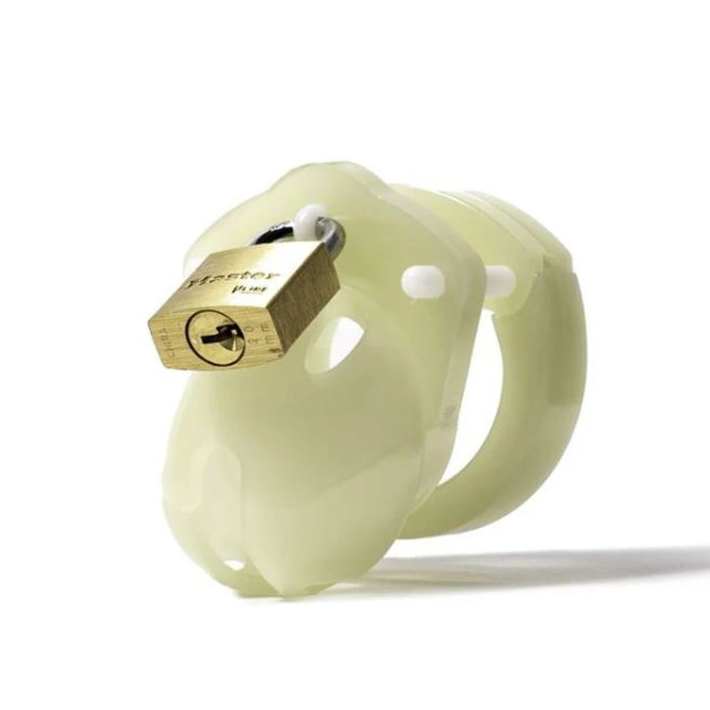 A glow-in-the-dark chastity cage with a brass padlock.