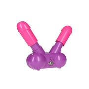A purple and pink dual water gun game with a humorous design.