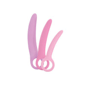 Curved silicone dilator set in purple, pink, and light pink.