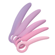 Curved silicone dilator set in shades of purple and pink.