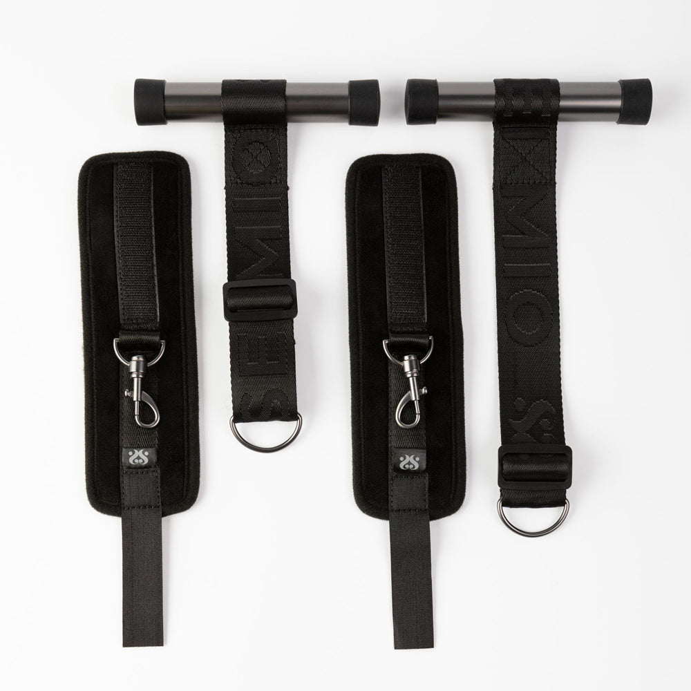 Adjustable over-door cuff restraints with padded straps.