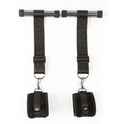 Adjustable over-door cuff restraints with padded straps.