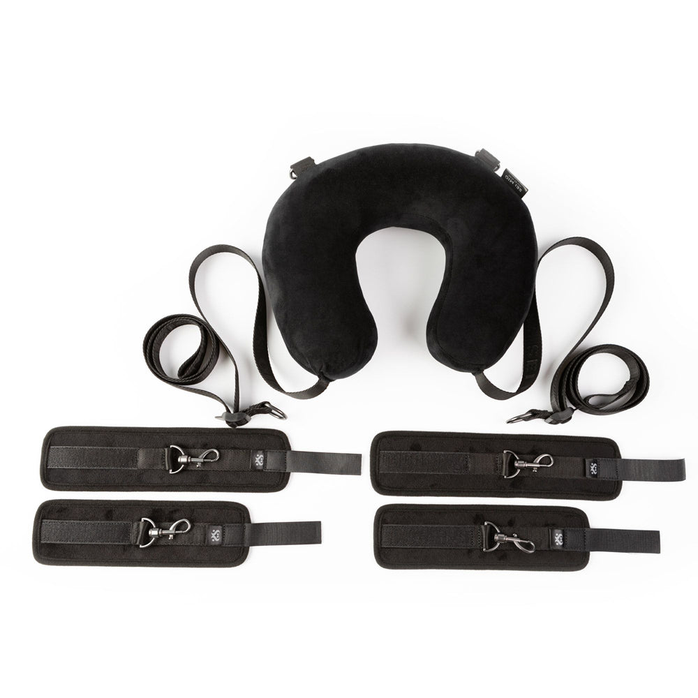 Black sex position restraint system with padded cuffs and neck cushion.