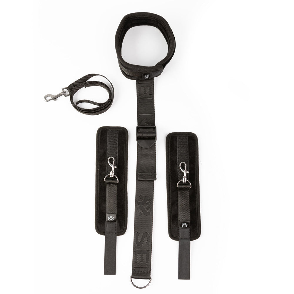 Adjustable black neck and wrist restraint kit with padded cuffs.