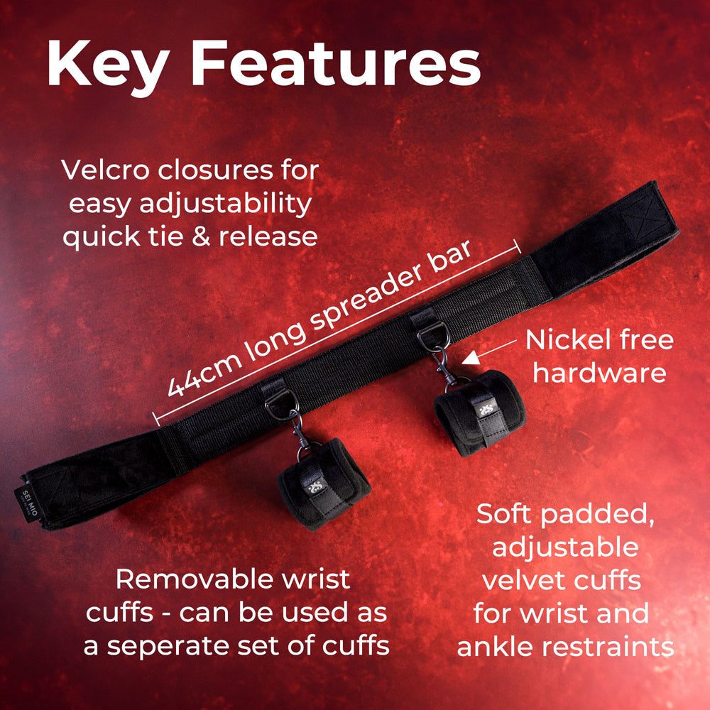 A black ankle spreader bar with velvet wrist cuffs and nickel-free hardware.