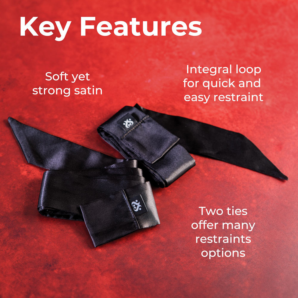 Two black satin sash restraints with integral loops for easy securing.