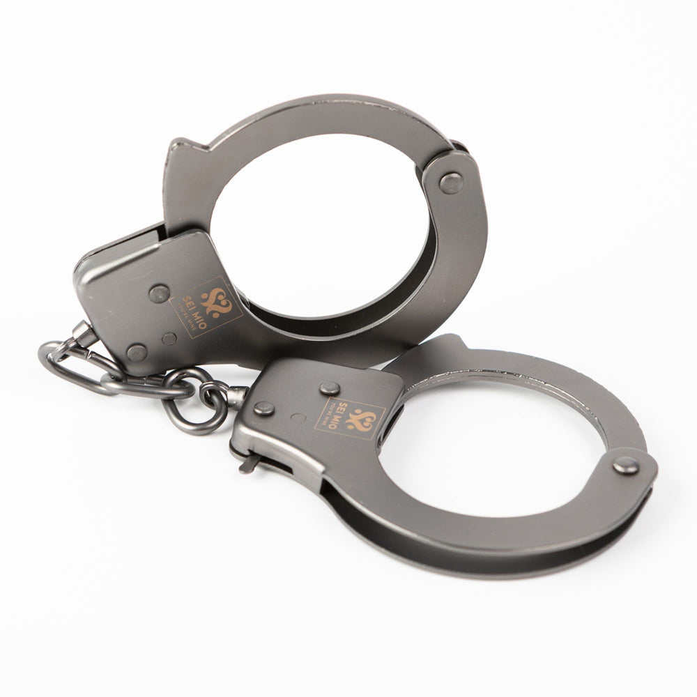 Robust metal handcuffs with quick release and branding.