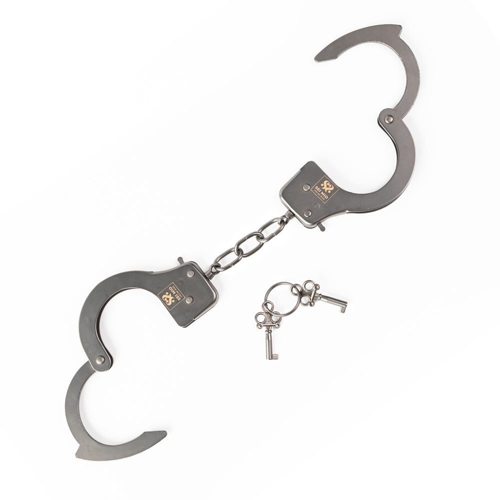 Robust metal handcuffs with two keys.