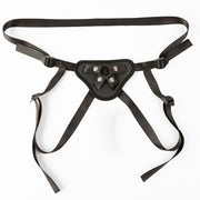 Black adjustable pegging harness with O-rings and vibe pocket.
