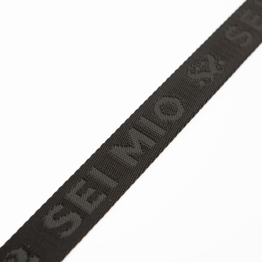 Black fabric strap with "SEI MIO" embossed in a repeating pattern.