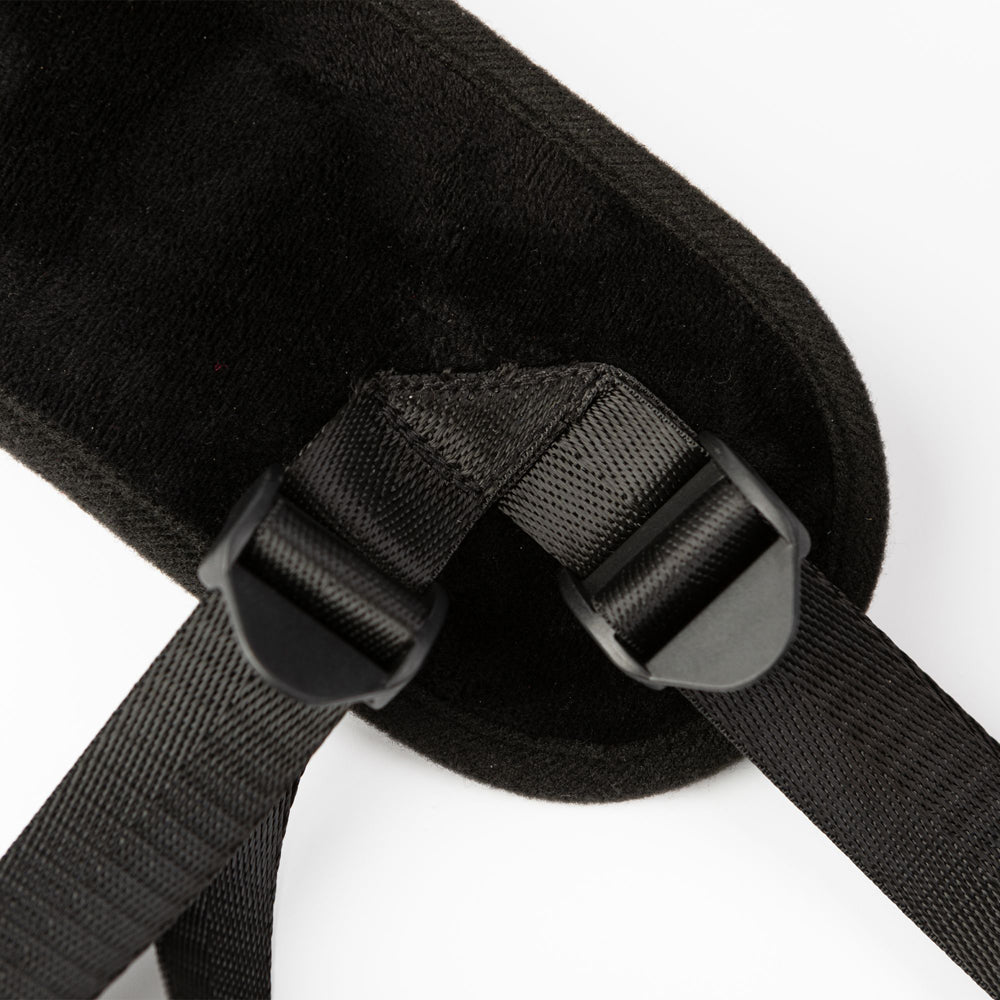 Black padded strap with adjustable buckles and nylon straps.