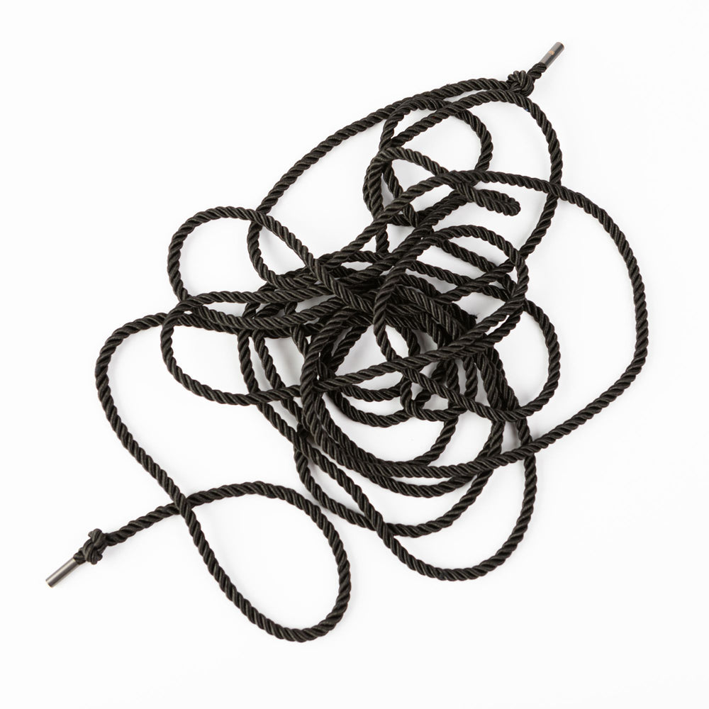 A tangled 10-meter black silky bondage rope with metal ends.