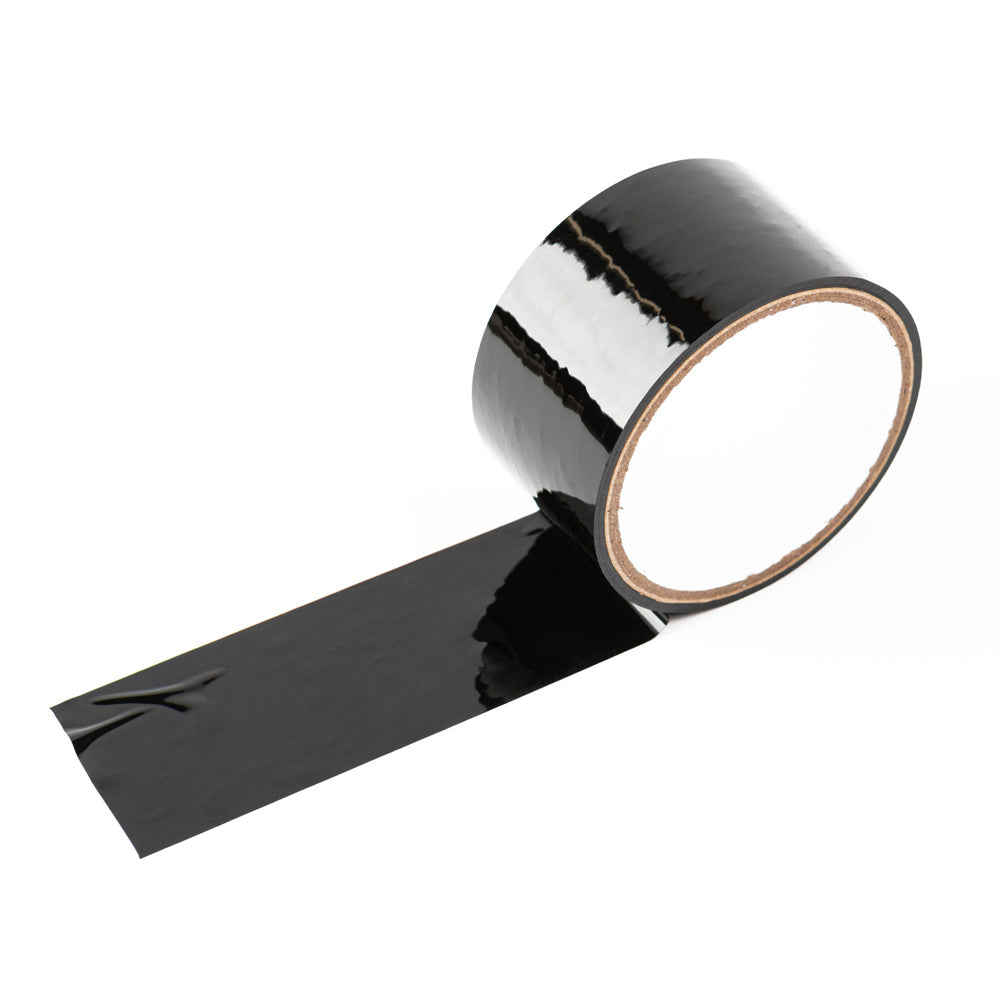 A roll of black, glossy, self-adhering tape with a length of tape unrolled.