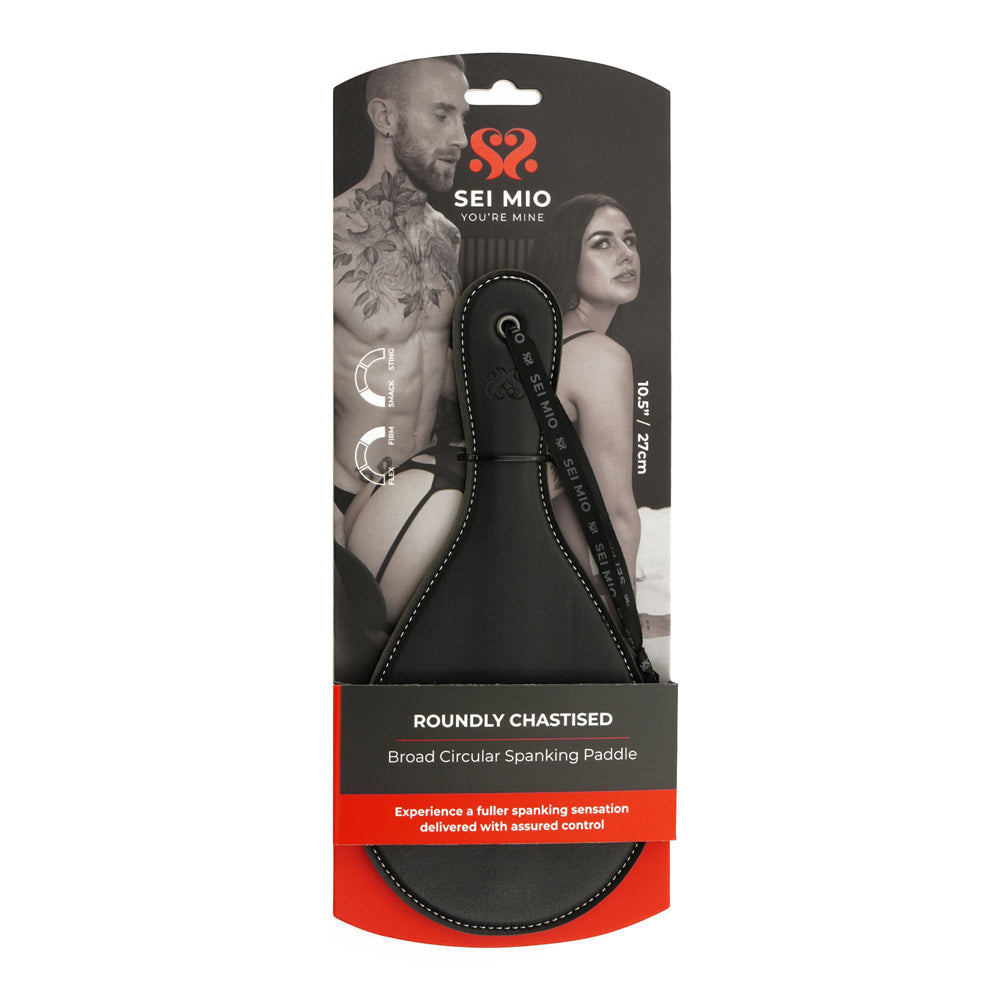 A black faux leather round spanking paddle with a wrist loop.