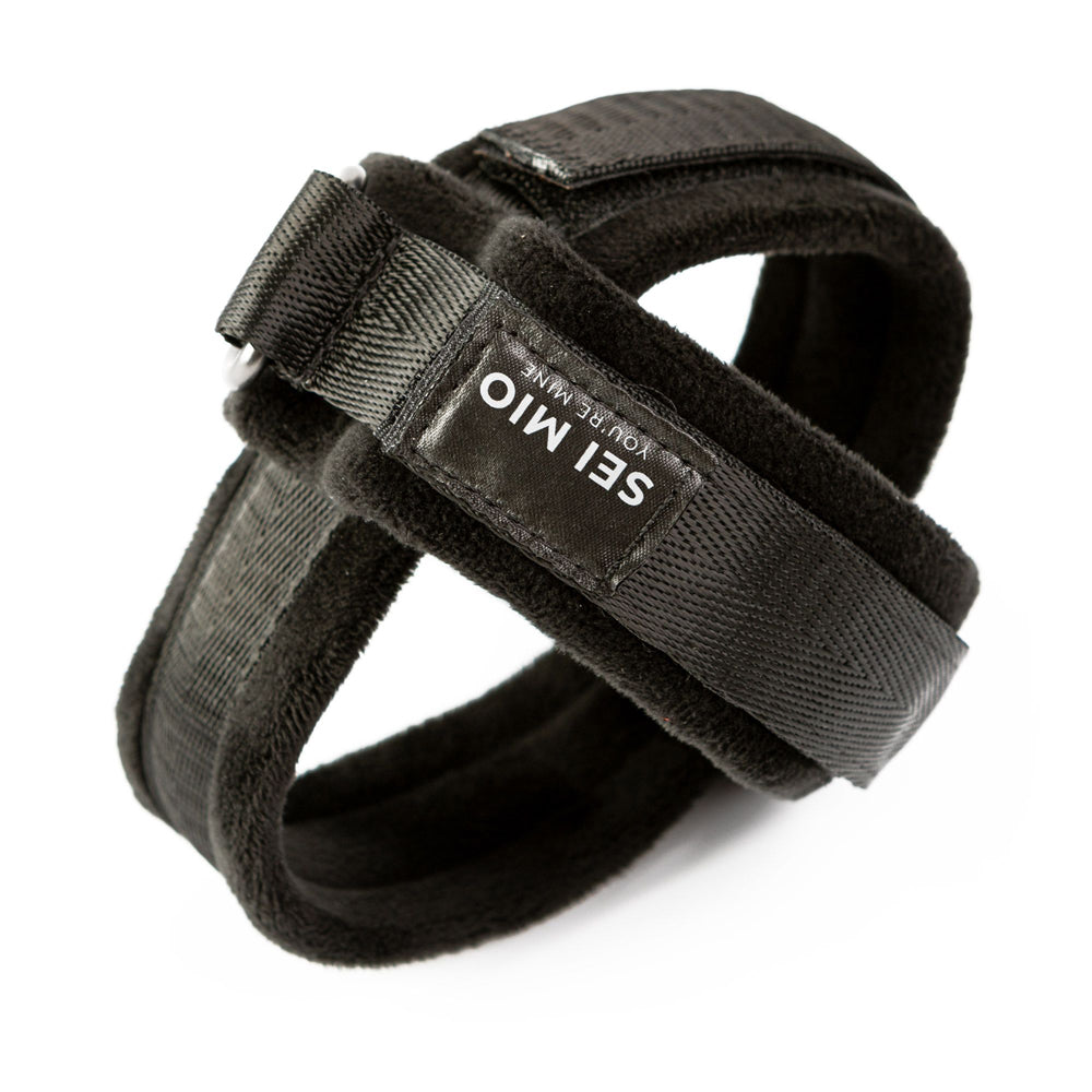 Black velvet wrist cuffs with D-rings and adjustable velcro straps.