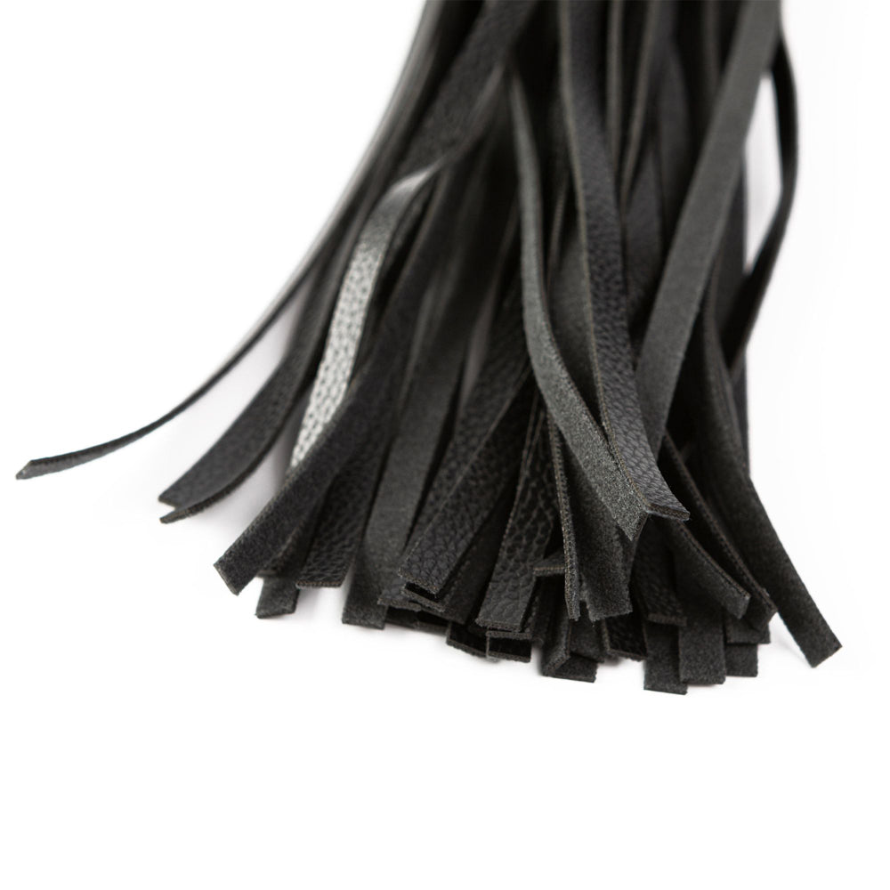 Black faux leather flogger with a textured surface.