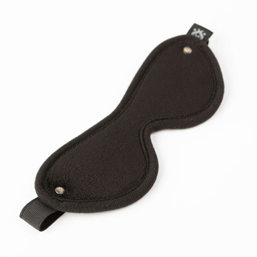 Black soft velvet blindfold with elastic strap and silver accents.