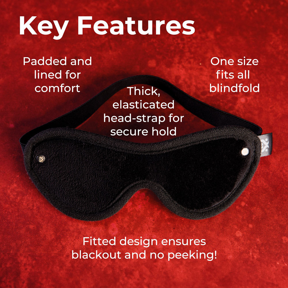 Soft black velvet blindfold with padded lining and elastic strap.