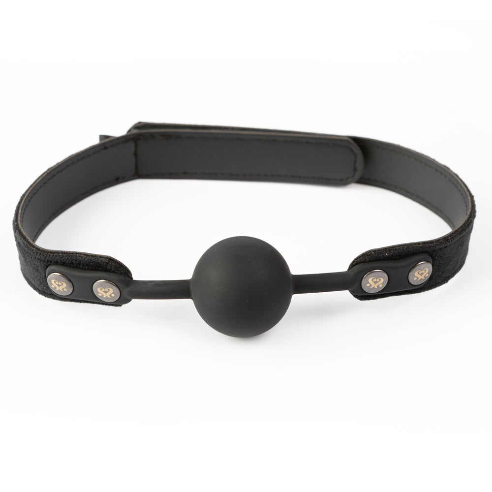 Black silicone ball gag with a velvet strap and metal accents.