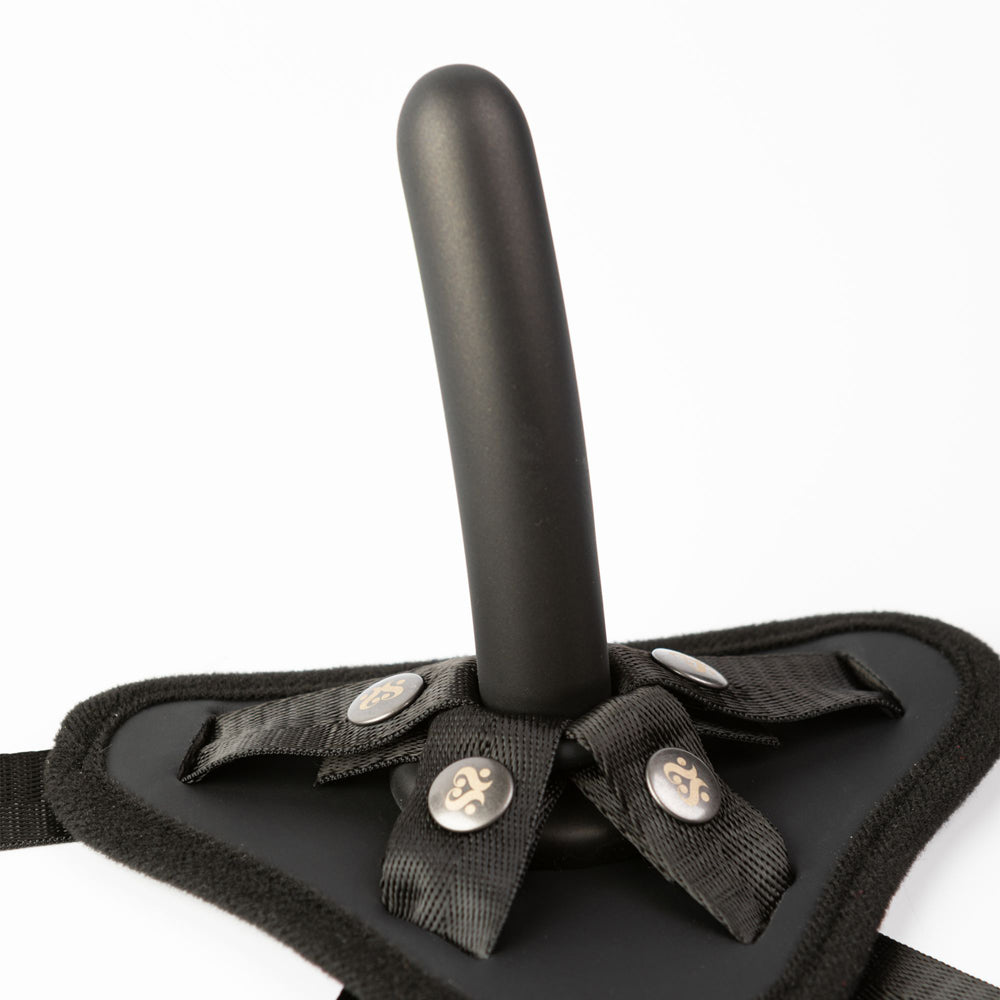 Adjustable strap-on harness with a black silicone dildo.