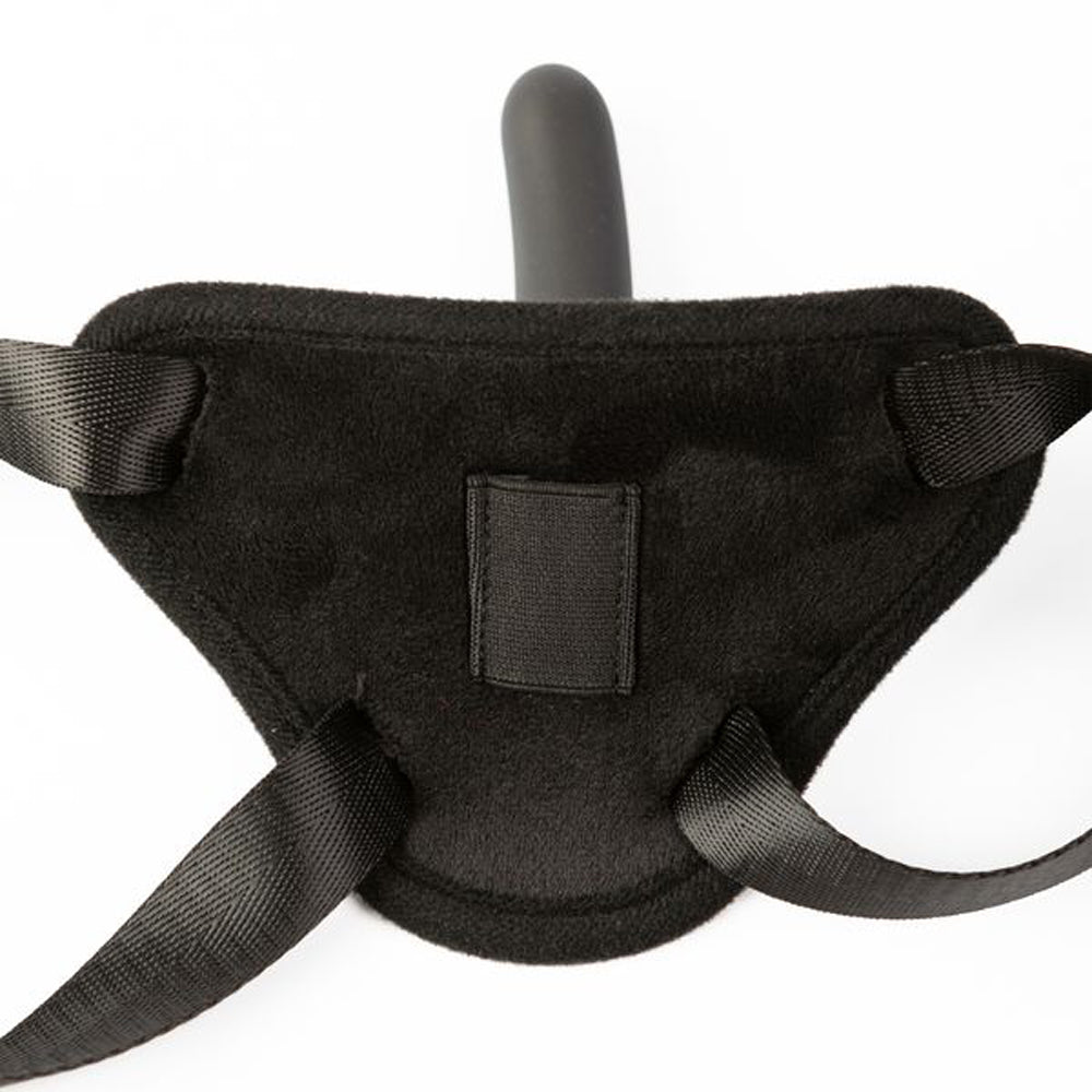 Black adjustable strap-on harness with a silicone dildo.