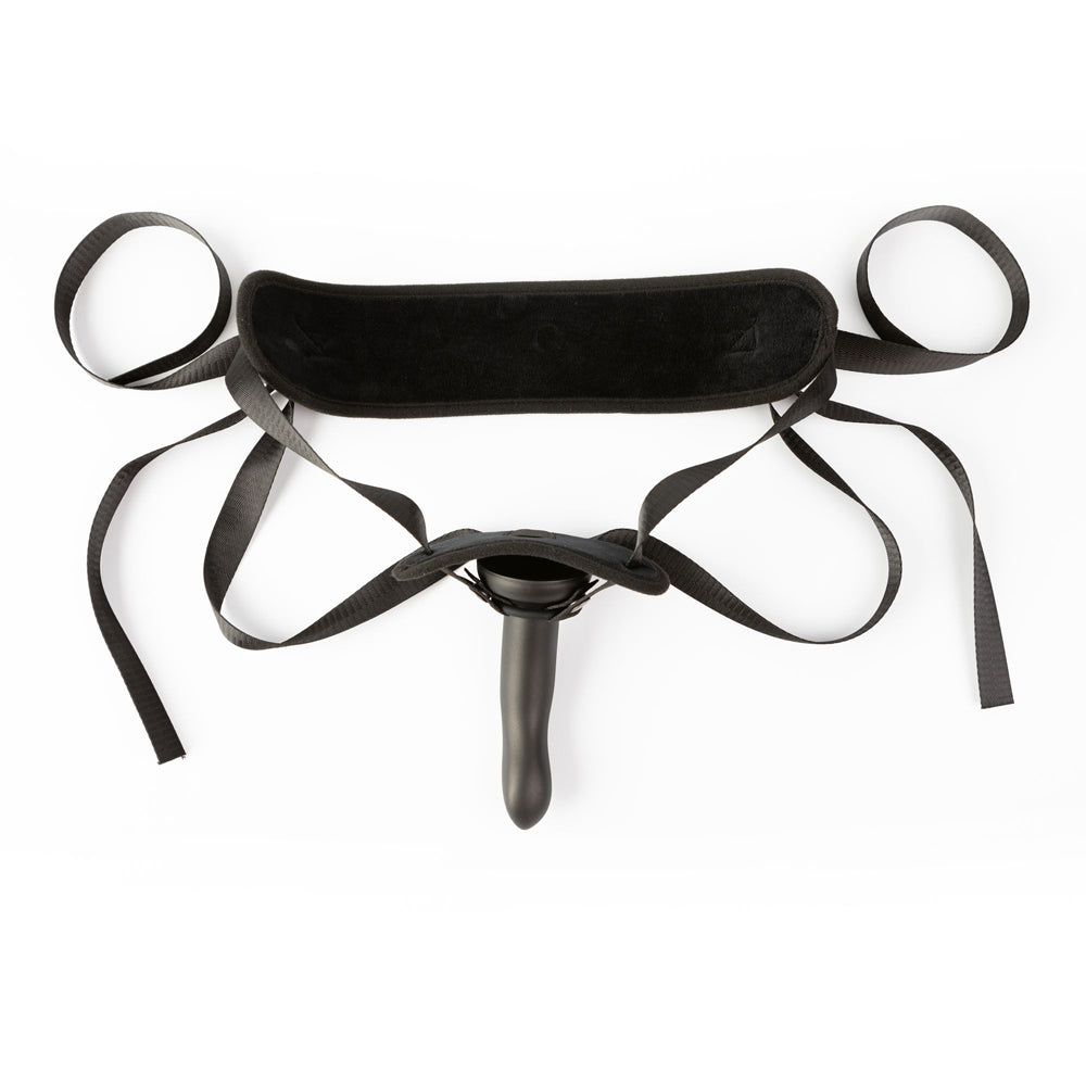 Adjustable black strap-on harness with a 7-inch silicone dildo.