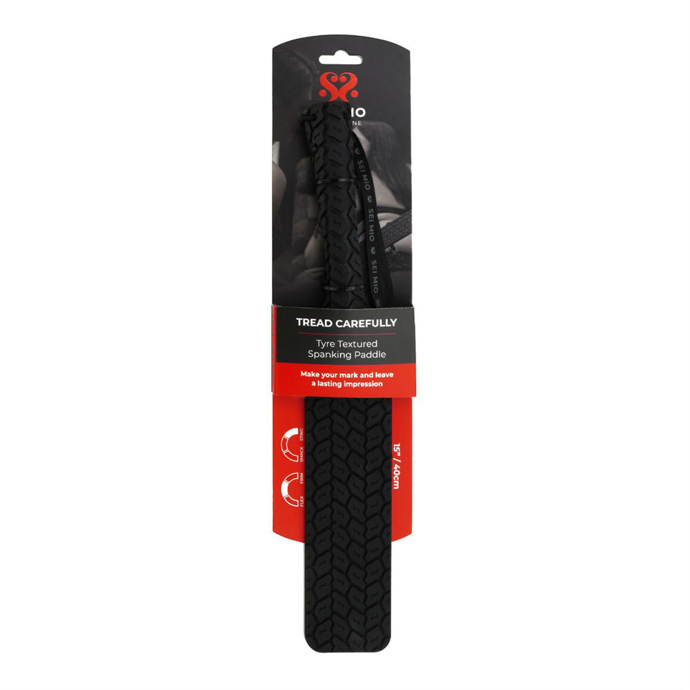 Tyre textured silicone spanking paddle with a tire tread pattern.