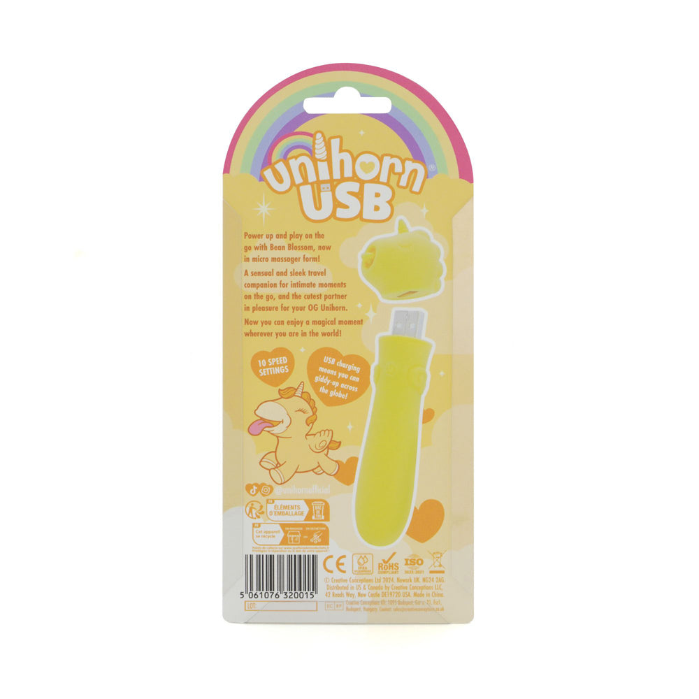 A yellow unicorn-shaped USB vibrator with rainbow accents and text.