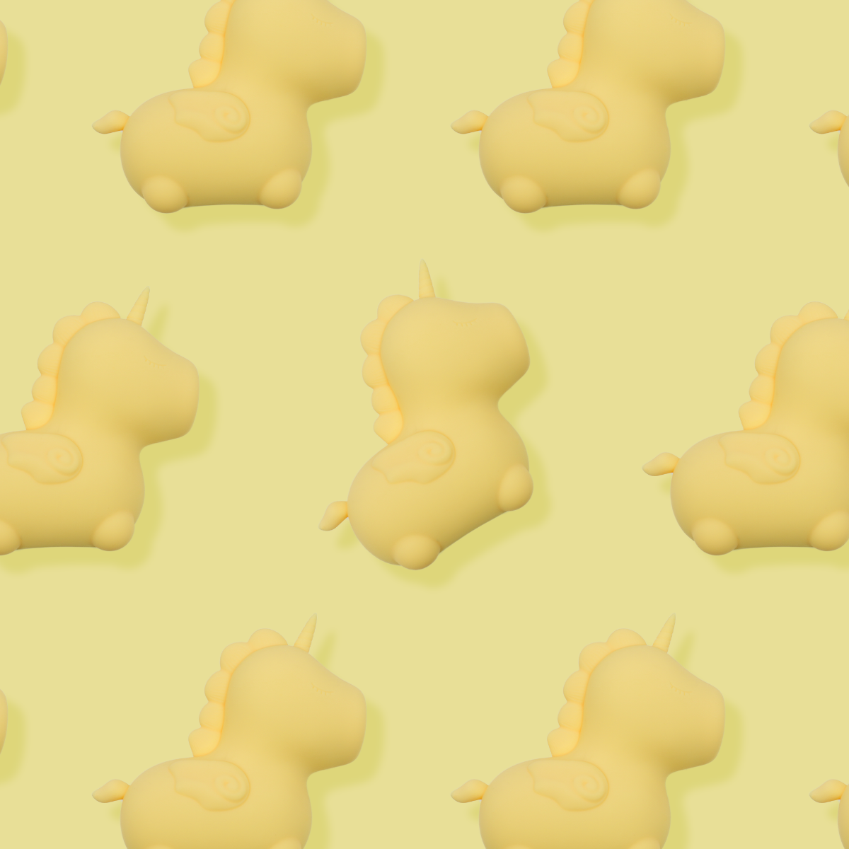 Yellow silicone unicorn toy on a light yellow background.